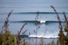 Lineup during a small swell on the Surf Coast Highway SH45, near New Plymouth, Taranaki, New Zealand.
