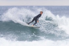 Keo Morrison during a small swell on the Surf Coast Highway SH45, near New Plymouth, Taranaki, New Zealand.
