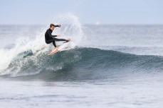 Sev Tolhurst during a small swell on the Surf Coast Highway SH45, near New Plymouth, Taranaki, New Zealand.