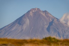 Mount Taranaki at a break on the Surf Coast Highway SH45, near New Plymouth, Taranaki, New Zealand.