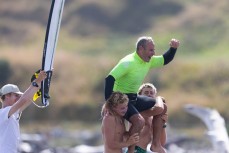 George Roberts Senior celebrates his win in the Over 45s with sons George and Frank at the Cape Classic held at Tauranga Bay, Westport, West Coast, New Zealand.