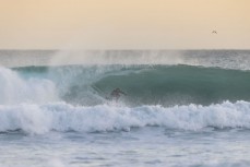 Jeff Patton on a hollow one during an evening session at Blackhead, Dunedin, New Zealand.Photo: Derek Morrison