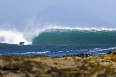 Che Bliss at a remote point break in the Catlins, New Zealand. Photo: Derek Morrison