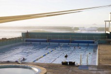 Waves break beyond the St Clair Hot Saltwater Pool at St Clair, Dunedin, New Zealand.