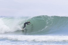 Keo Morrison pumps into a barrel during a swell on the north coast of Dunedin, New Zealand.