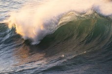 Wave at sunrise on the Otago coastline, Dunedin, New Zealand. Photo: Derek Morrison