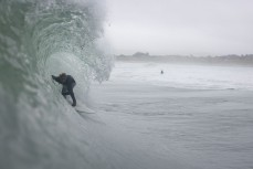 Reuben Morrison gets barrelled during a swell on the north coast of Dunedin, New Zealand.