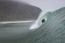 Felix Dickson gets barrelled during a swell on the north coast of Dunedin, New Zealand.