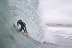 Jai Wallis gets barrelled during a swell on the north coast of Dunedin, New Zealand.