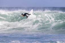Reuben Morrison at a remote reef break in the Catlins, New Zealand. Photo: Derek Morrison