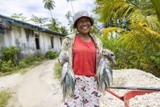 Local fisherwoman at Hollow Trees in the Mentawais Island chain, Western Sumatra, Indonesia.