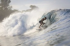 Keo Morrison gets barreled at a remote wave in the Mentawai Islands, Sumatra, Indonesia.