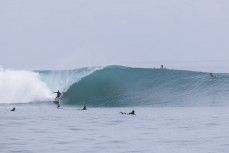 Brett Wood on a large wave at a remote break in the Mentawai Islands, Sumatra, Indonesia.