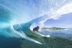 Chris Scurrah gets a barrel at a remote reefbreak in the Mentawai Islands, Sumatra, Indonesia.