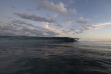 George Roberts gets barreled at a remote reefbreak in the Mentawai Islands, Sumatra, Indonesia.