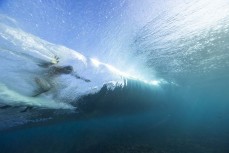 George Roberts gets barrelled at a remote right reefbreak in the Mentawai Islands, Sumatra, Indonesia.