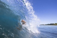 Frank Roberts gets barreled at a remote reefbreak in the Mentawai Islands, Sumatra, Indonesia.