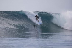 Josh Edington-Lalande drops into a glassy wall in the Mentawai Islands, Sumatra, Indonesia.