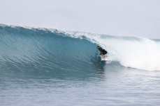 Brett Wood gets barreled at a remote reef in the Mentawai Islands, Sumatra, Indonesia.