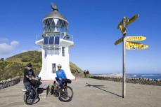 Adventurers Huw Kingston and Laurence Mote prepare to ride from Cape Reinga to Slope Point to raise awareness for climate change. Here they tackle the first section at Cape Reinga, Northland, New Zealand.