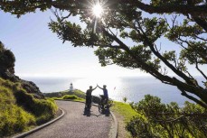 Adventurers Huw Kingston and Laurence Mote prepare to ride from Cape Reinga to Slope Point to raise awareness for climate change. Here they tackle the first section at Cape Reinga, Northland, New Zealand.