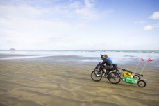 Adventurers Huw Kingston and Laurence Mote prepare to ride from Cape Reinga to Slope Point to raise awareness for climate change. Here they tackle the first section at Cape Reinga, Northland, New Zealand.