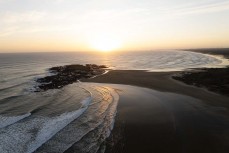 Sunset over Te Wakatehaua (Maunganui Bluff) on 90-mile-beach, Northland, New Zealand.