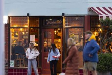 Busy winter evening at the Esplanade Restaurant at St Clair, Dunedin, New Zealand.