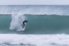 Keo Morrison picks the eyes out of a winter session at Blackhead, Dunedin, New Zealand.