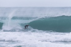 Keo Morrison picks the eyes out of a winter session at Blackhead, Dunedin, New Zealand.