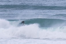 Keo Morrison picks the eyes out of a winter session at Blackhead, Dunedin, New Zealand.