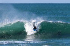 Jeff Patton drops in during a punchy swell on the South Coast near Dunedin, New Zealand.