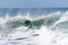 Keo Morrison chasing barrels during a punchy swell on the South Coast near Dunedin, New Zealand.