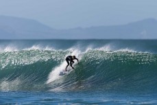 Keo Morrison chasing barrels during a punchy swell on the South Coast near Dunedin, New Zealand.