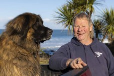 Graham Carse with his dog Zak on the South Coast near Dunedin, New Zealand.