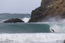 Alexis Owen on a board breaker during a southerly swell at a beach break on the Otago Peninsula, Dunedin, New Zealand.