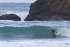 James Charlesworth during a southerly swell at a beach break on the Otago Peninsula, Dunedin, New Zealand.