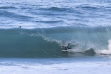 Lewis Murphy during a southerly swell at a beach break on the Otago Peninsula, Dunedin, New Zealand.