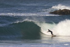 James Charlesworth during a southerly swell at a beach break on the Otago Peninsula, Dunedin, New Zealand.