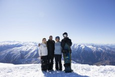 Rewa, Derek, Taya and Keo Morrison atop Mt Cardrona at Cardrona ski field, Cardrona Valley, Wanaka, New Zealand.