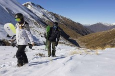 Rewa and Keo Morrison walk out of the bottom of the Motutapu Chutes at Treble Cone ski field, Wanaka, New Zealand.