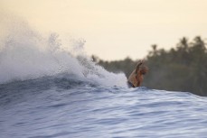 Adam Scott sends it on a remote right hand reefbreak in the Mentawai Islands, Sumatra, Indonesia.