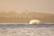 A clean swell wraps into a remote reefbreak in the Mentawai Islands, Sumatra, Indonesia.