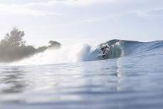 Keo Morrison makes the most of a magic run of swell continues at dawn at a remote lefthand reefbreak in the Mentawai Islands, Sumatra, Indonesia.