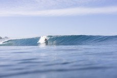 Frank Roberts drops into a clean wall at a remote lefthand reefbreak in the Mentawai Islands, Sumatra, Indonesia.