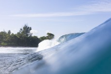 A magic run of swell continues at dawn at a remote lefthand reefbreak in the Mentawai Islands, Sumatra, Indonesia.