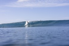 Dave Lyons enjoys a magic run of swell at dawn at a remote lefthand reefbreak in the Mentawai Islands, Sumatra, Indonesia.