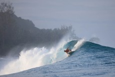 Chris "Scuzz" Scurrah leading the way on a big day at a remote left in the Mentawai Islands, Sumatra, Indonesia.