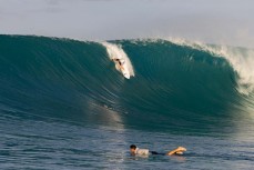 A surfer knifes into a tricky section at a popular reefbreak in the Mentawai Islands, Sumatra, Indonesia.