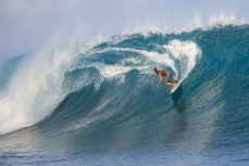 Chris "Scuzz" Scurrah leading the way on a big day at a remote left in the Mentawai Islands, Sumatra, Indonesia.